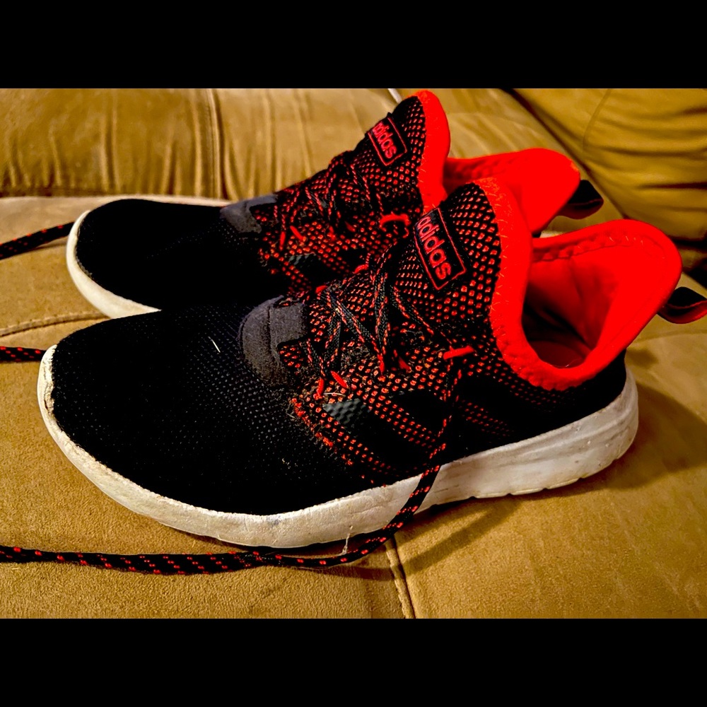 Red and black adidas shoes